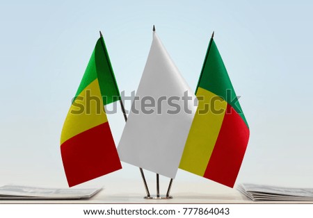 Flags of Mali and Benin with a white flag in the middle