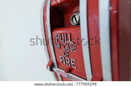 close up fire alarm for sign  texture on that and white wall blackground.To give realism feeling.concept danger and security. 