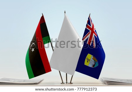 Flags of Libya and Saint Helena with a white flag in the middle
