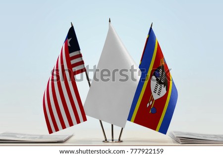 Flags of Liberia and Swaziland with a white flag in the middle