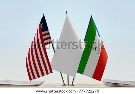 Flags of Liberia and Equatorial Guinea with a white flag in the middle