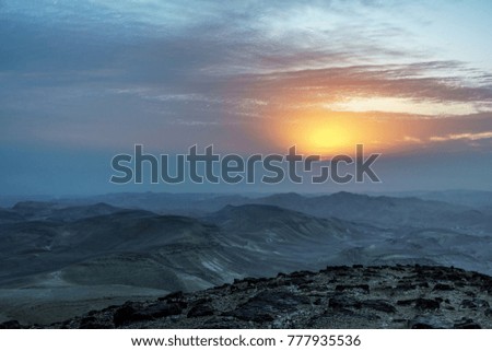 Magic morning dawn in judean desert Israel. Landscape sunrise on holy land with beautiful nature clouds, mountains and rocks. Travel tourism and nobody on photo