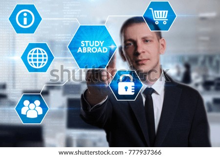 Business, Technology, Internet and network concept. Young businessman working on a virtual screen of the future and sees the inscription: Study abroad