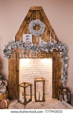 Wooden fireplace decorated for Christmas and New Year. Christmas and New Year