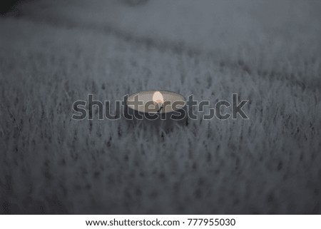 Candle on snow