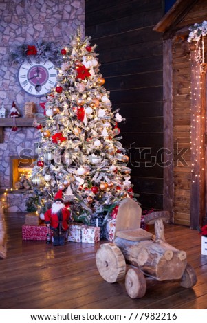 Christmas tree in classic red color with clock and wood