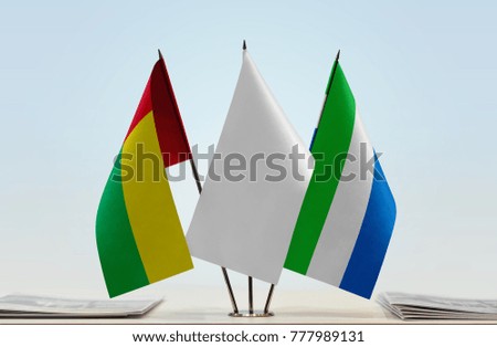 Flags of Guinea-Bissau and Sierra Leone with a white flag in the middle