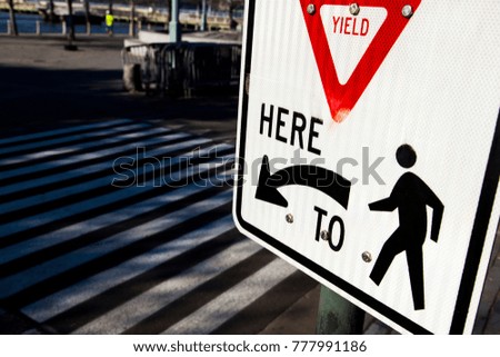 Sign pointing pedestrians where to go.