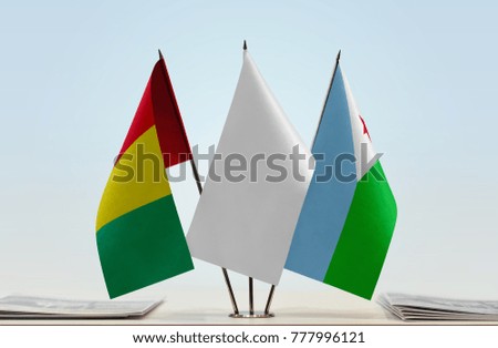 Flags of Guinea and Djibouti with a white flag in the middle