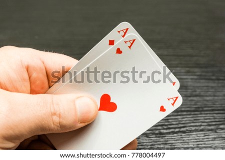 Two aces (Hearts and Tiles) in the hand held.