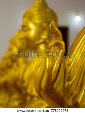 Gold hand of Buddha statue in Thai temple