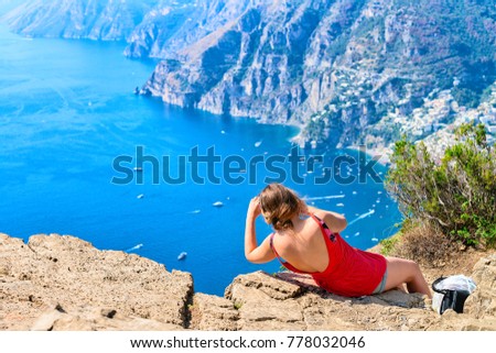 Woman taking photos of beautiful scenery at Path of Gods at Tyrrhenian sea, Amalfi coast, Italy