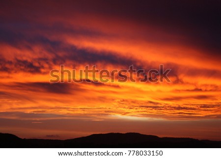 burning sky evening red heavy clouds chemical purple sky