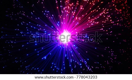 Multicolored optical fiber cables with shining tips on a black background   Royalty-Free Stock Photo #778043203