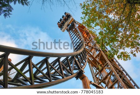 Abandoned theme park roller coaster ride in autumn in europe Royalty-Free Stock Photo #778045183