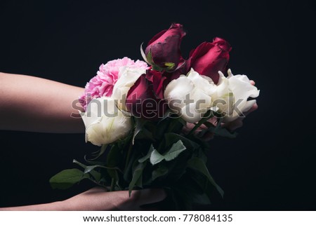 Two hand hold flower : white rose,red rose and pink carnation, for give someone with love and take care in special day or valentine day.