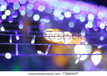 Blur picture of Christmas tree with blue lighting bokeh abstract background on night for happy new year party