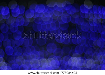 Blur picture of Christmas tree with blue lighting bokeh abstract background on night for happy new year party