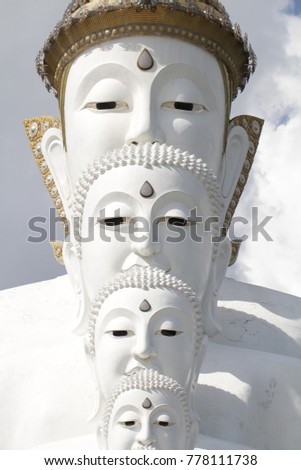 couple peaceful white buddha statues sitting well alignment and decorating wonderful attractive mirror, one of the most interesting landmark in north of Thailand, home decoration picture