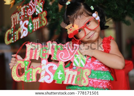 Asian girl praying for Christmas. hands folding in prayer for christmas in church concept for faith, Christmas spirituality and religion.