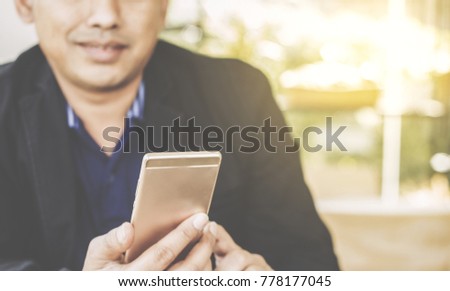 businessman using smart phone,Social media concept / soft focus picture / Vintage concept