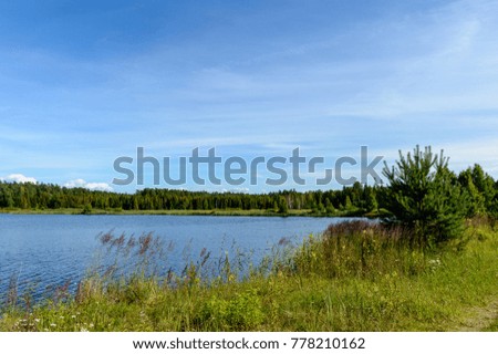 colorful lake river in countryside in summer. nature in latvia
