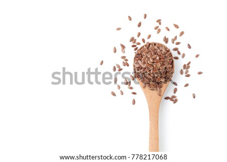Flax seeds in a wooden spoon on white background Royalty-Free Stock Photo #778217068