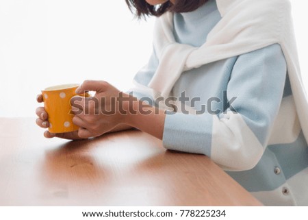 A woman with a mug