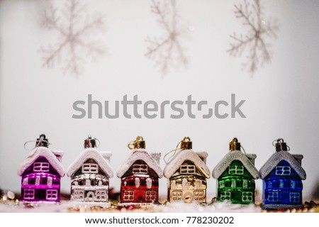 Christmas tree decorations in form of colored houses, snowflakes. New Year city banners with traditional europe houses. Happy New Year and Merry Christmas concept. Greeting card with place for text.
