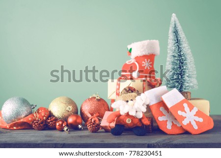 Festive Christmas tree stands on dark boards. Christmas background. Christmas decorations on a green background. Space for text. New Year's background. Toned image.