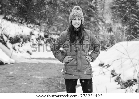 Woman walk and rest in snowy mountains forest, alpine view, snow on hills. Winter magical time for good vacation. 