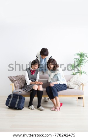 Family watching tablet screen