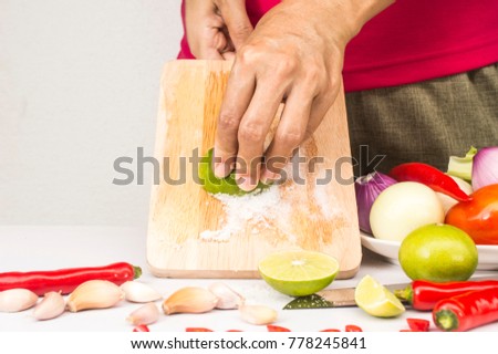 rub chopping board with salt and lemon and wash with water can get rid of meat smell