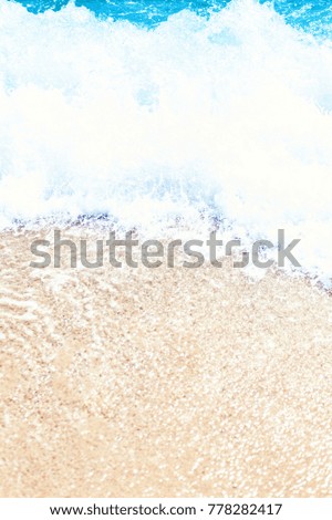 Soft wave of blue ocean on sandy beach Background with place for text. Tropical summer vacation concept
