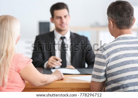 Mature couple at notary public office Royalty-Free Stock Photo #778296712