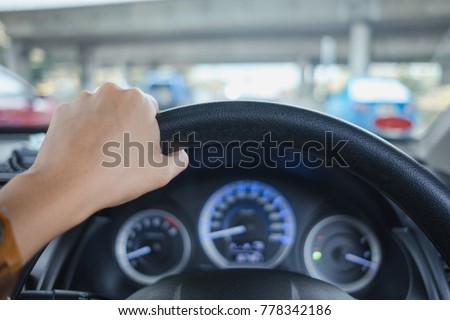 car interior background young woman drive car with hand. image for vehicle, body, transport, speed concept
