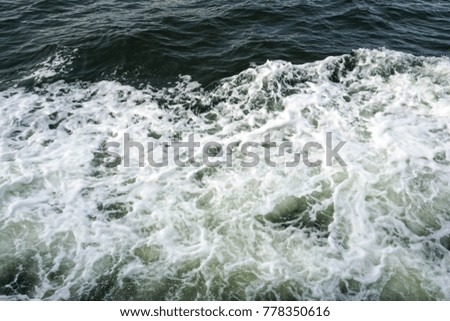 blurry images on the sea. the scenery is in the middle of the ocean. sea waves