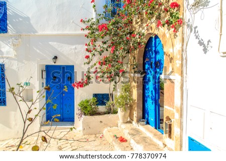 White-blue city of Sidi Bou Said, Tunisia. Eastern fairy tale with a French charm. Royalty-Free Stock Photo #778370974