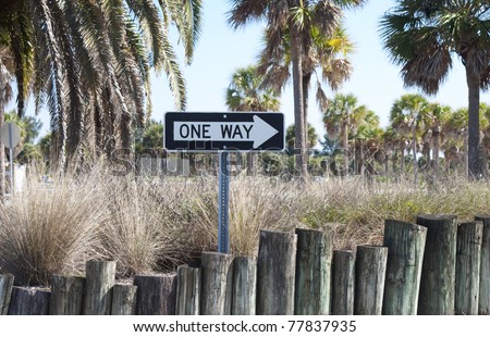 "One Way" sign, at a beach parking lot