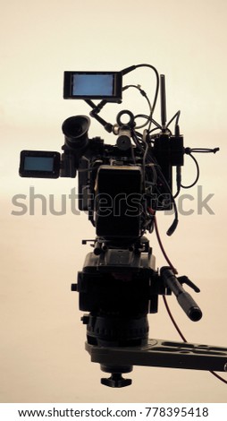 4K high defination video camera with tripod shooting in studio production and no people.