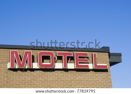 Motel on brick wall neon signage