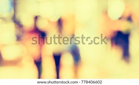 Abstract Blurred image of People walking at airport 's hallway  for background usage. (vintage tone)
