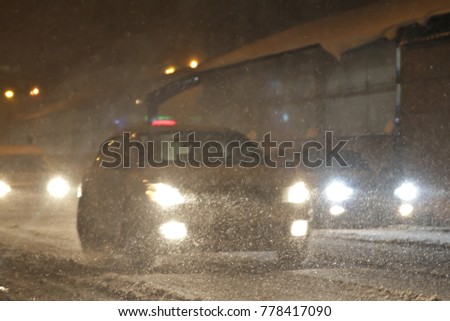 snowfall on the evening streets. blur specifically enhance movement