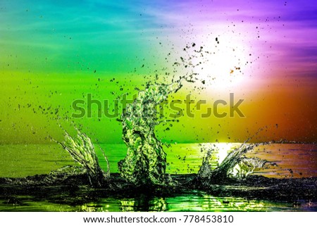 Rainbow colorful water splash background at sunset. Cool, fresh wallpaper concept