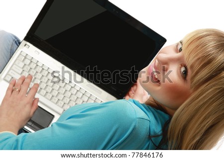 A young woman with a laptop, from above