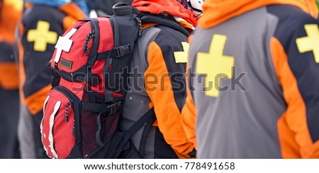 First aid ski patrol with backpacks and gear. Alberta, Canada. Royalty-Free Stock Photo #778491658