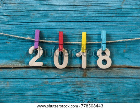New Year concept for 2018 : Wood numbers 2018 on wood table background.