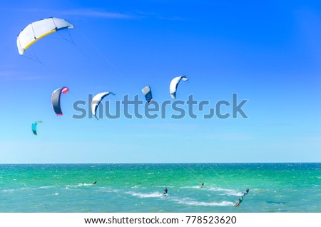 Beach in Cumbuco at the Ceara state with multiple kite surfing sport people Royalty-Free Stock Photo #778523620