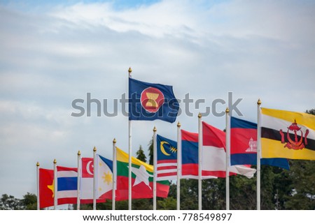 ASEAN Economic Community flags, southeast asia countries and sky background Royalty-Free Stock Photo #778549897