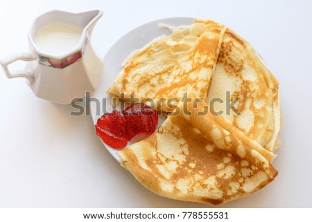 Sweet morning. Gorgeous breakfast hot pancakes jam and milk. Rustic style. Top view. Flat lay.